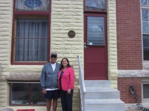 Roland Moskal with Lisa Doyle in front of 3408 Fait Avenue.