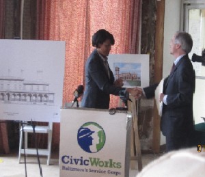 Mayor Rawlings-Blake signs Clifton renovation rendering with Civic Works Director Dana Stein
