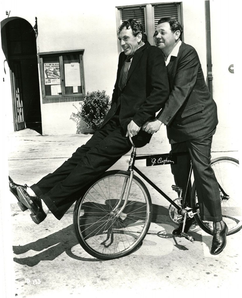Gary Cooper and Babe Ruth ride a bike, 1942.