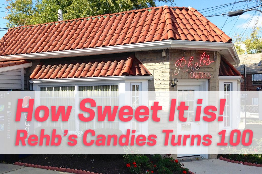 A small candy store with a tile roof and a neon sign reading: "Rheb's" Overlaid pink text reads: "How Sweet It Is! Rehb's Candies Turns 100"